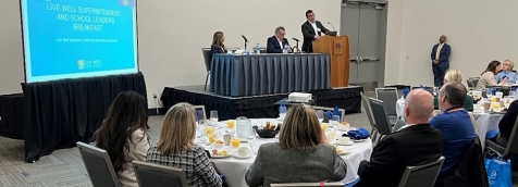 Group gathered in conference room for summit