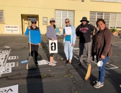 HSEC Team working with Carson Elementary Staff to install playground stencils
