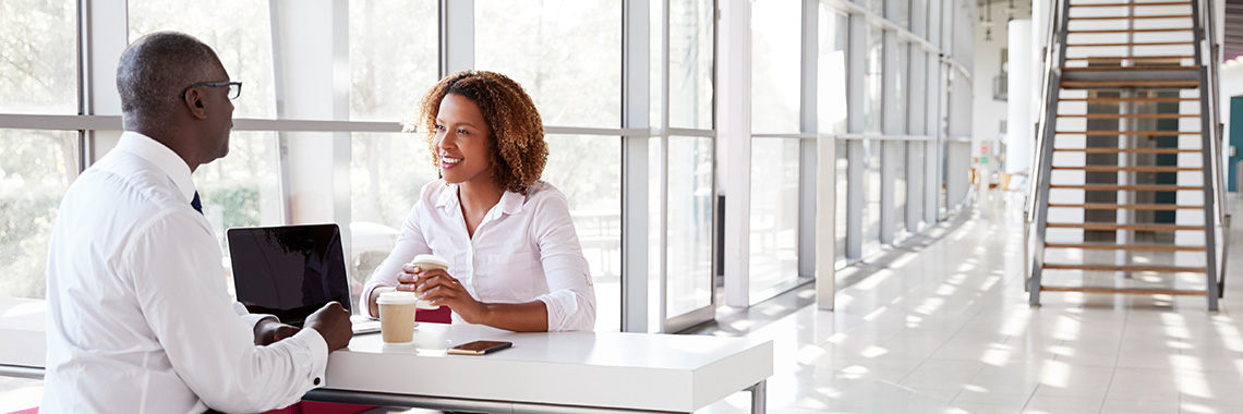 3x1 banner Project MOST two BIPOC people in discussion in an office