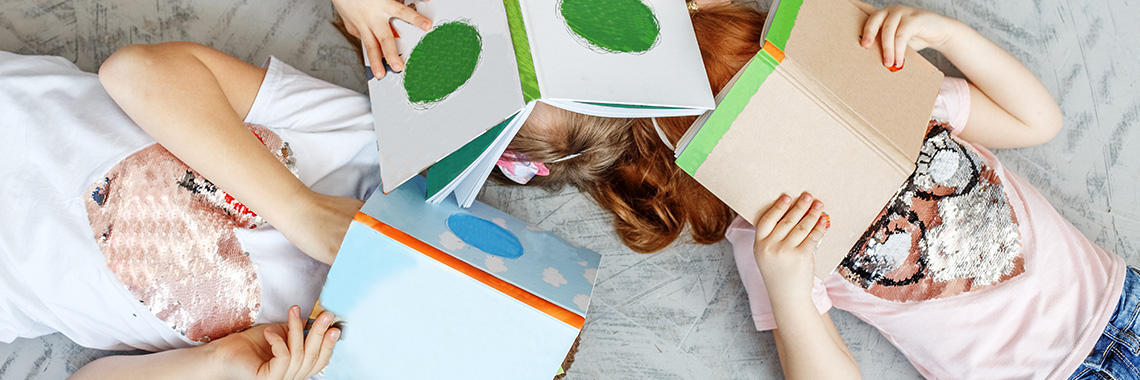 children reading book image banner for SDCCU story