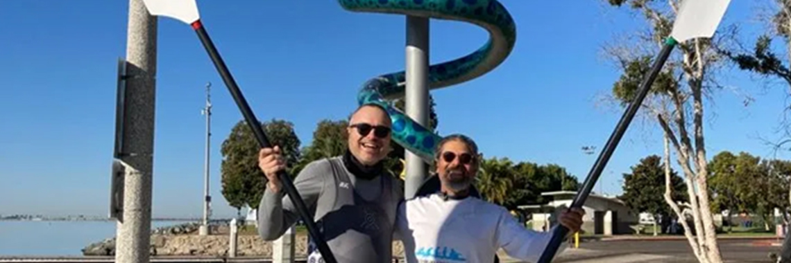 Community Rowing of San Diego and Club de Remo Tijuana Posing Together With Paddle Sticks