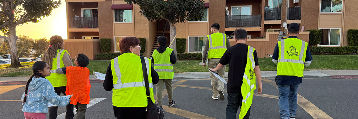 Community HousingWorks banner showing residents doing a safety walk audit
