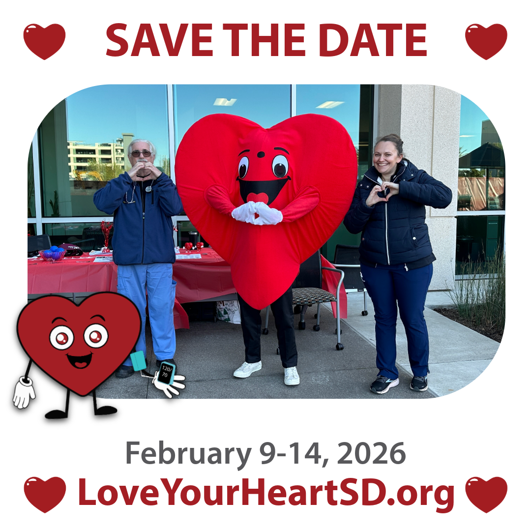 hearty mascot posing with volunteers