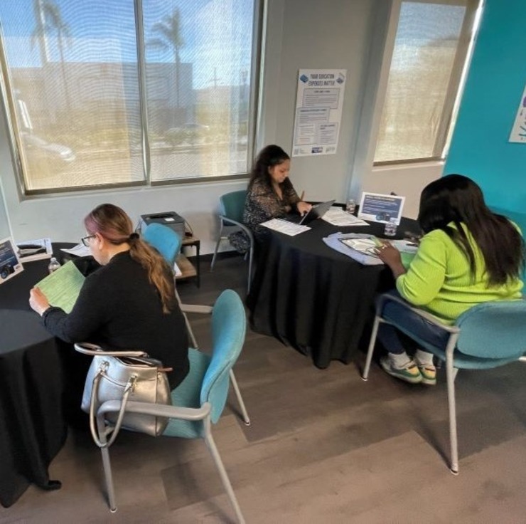 Shot of multiple people receiving EITC tax services