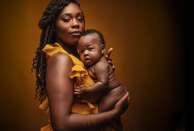 mother holding infant