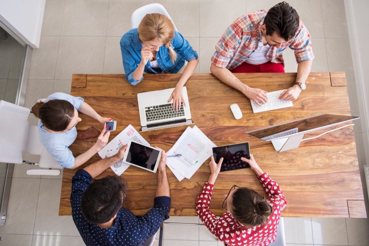 overhead view of people working together at a table