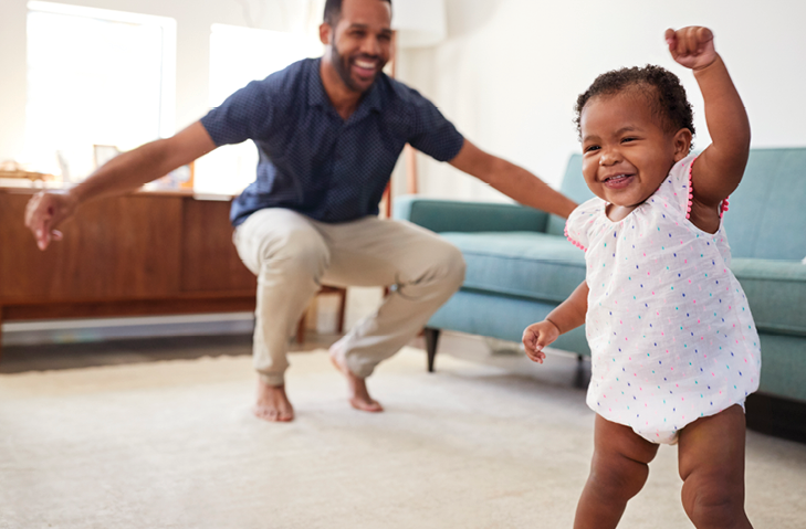 Family dancing in the living room