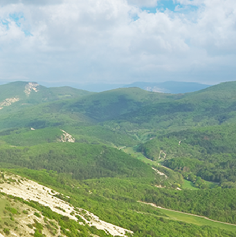Green hills under a cloudy sky